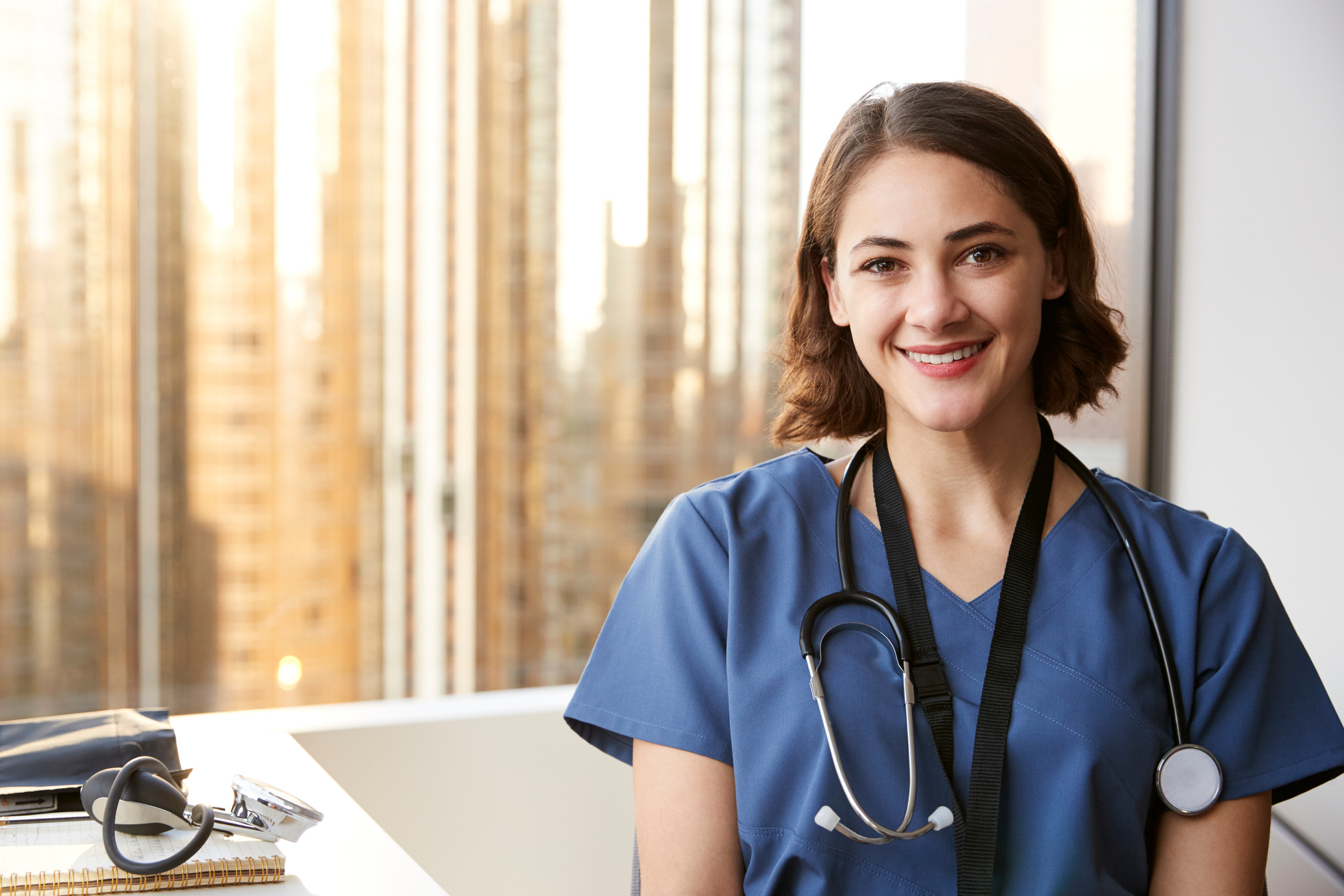 Smiling Female Doctor Wearing Scrubs